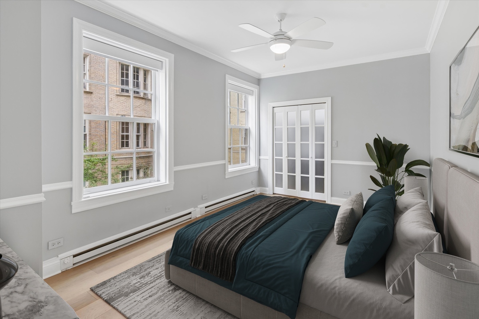 70 East Scott Street, Unit 306 Chicago, IL 60610 - Photo 10 of 17 a bed sitting in a bedroom next to a window