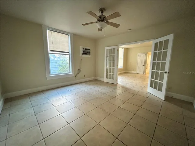 a view of an empty room with a window