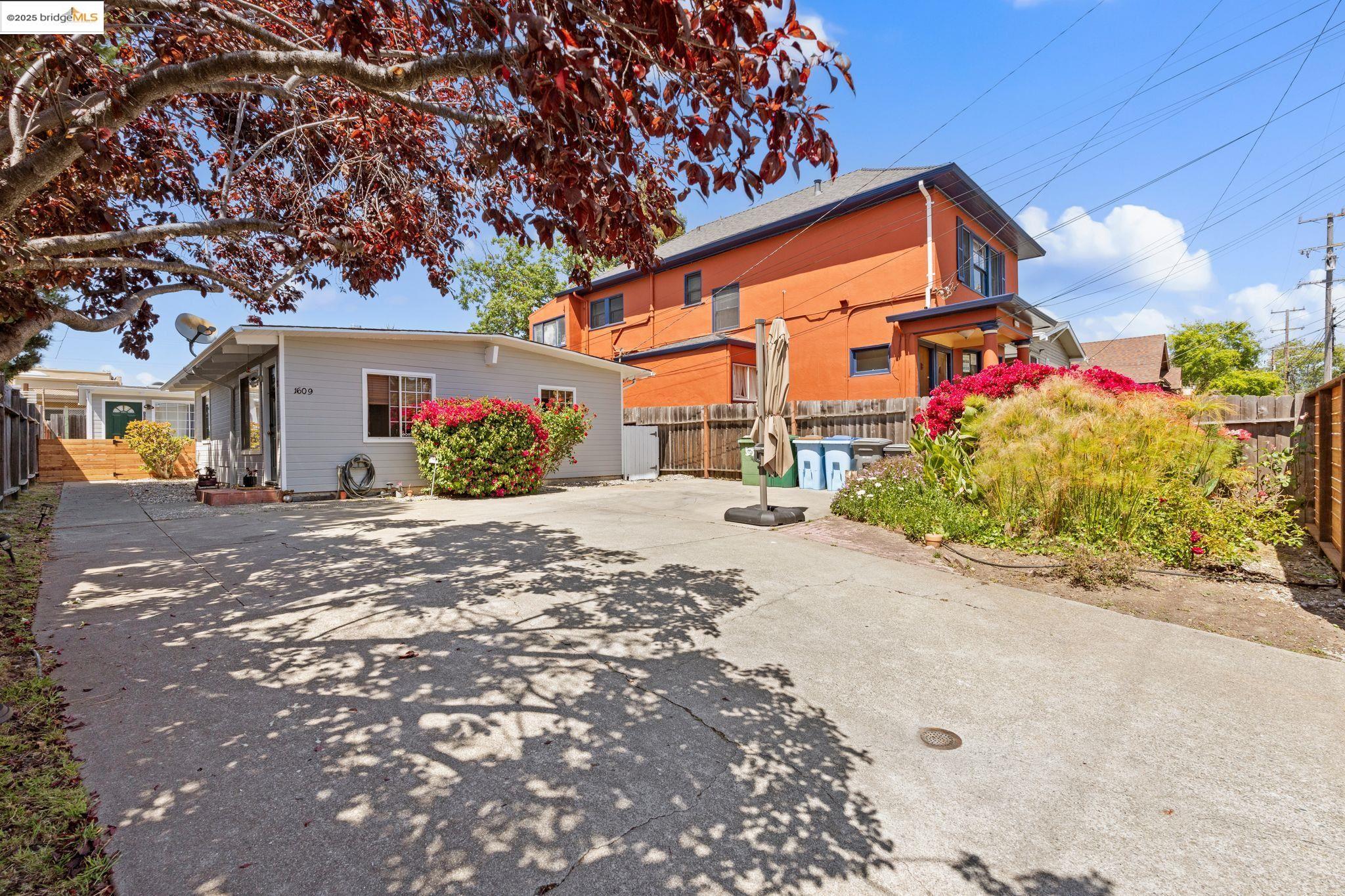 a front view of a house with a yard and a garage