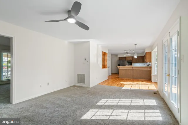 a view of a livingroom with a furniture and ceiling fan