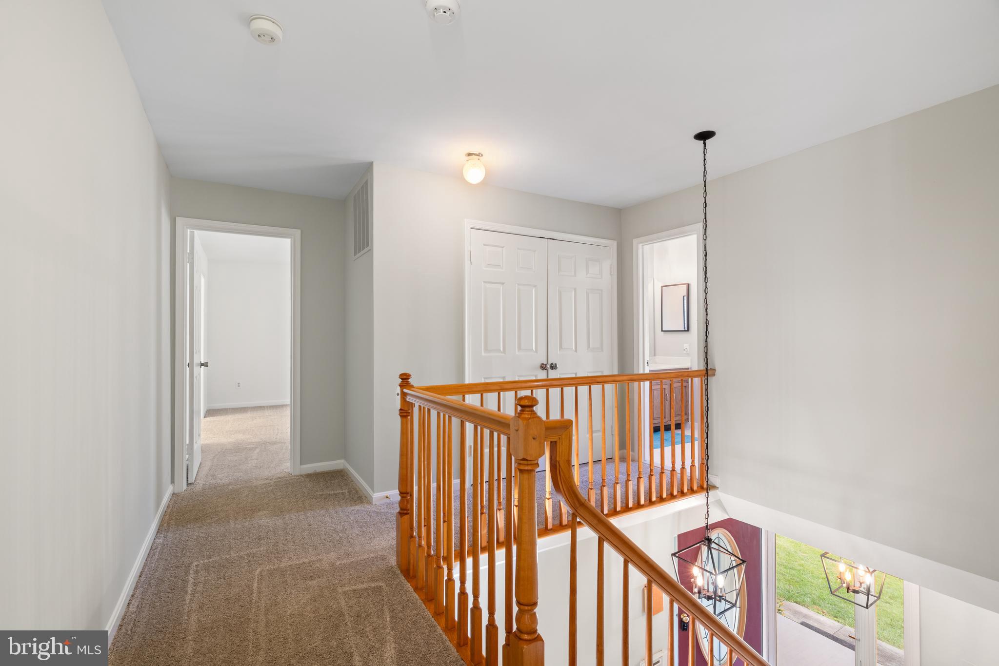 6218 Stonehunt Place Clifton, VA 20124 - Photo 25 of 37 a view of hallway with stairs