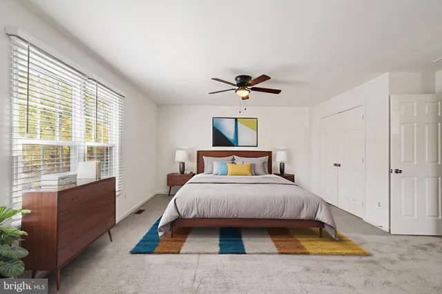 a bedroom with a bed and window