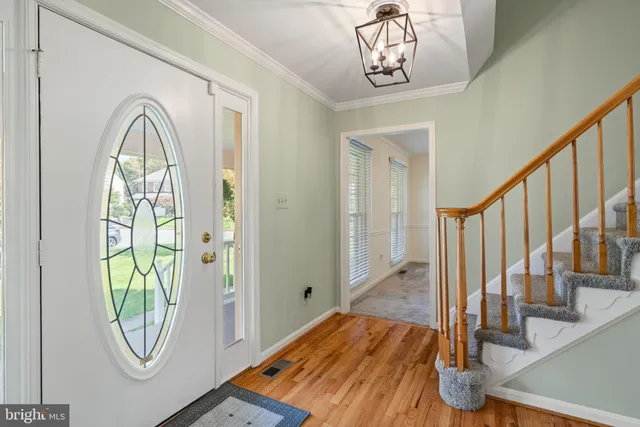 a view of a livingroom with wooden floor and door