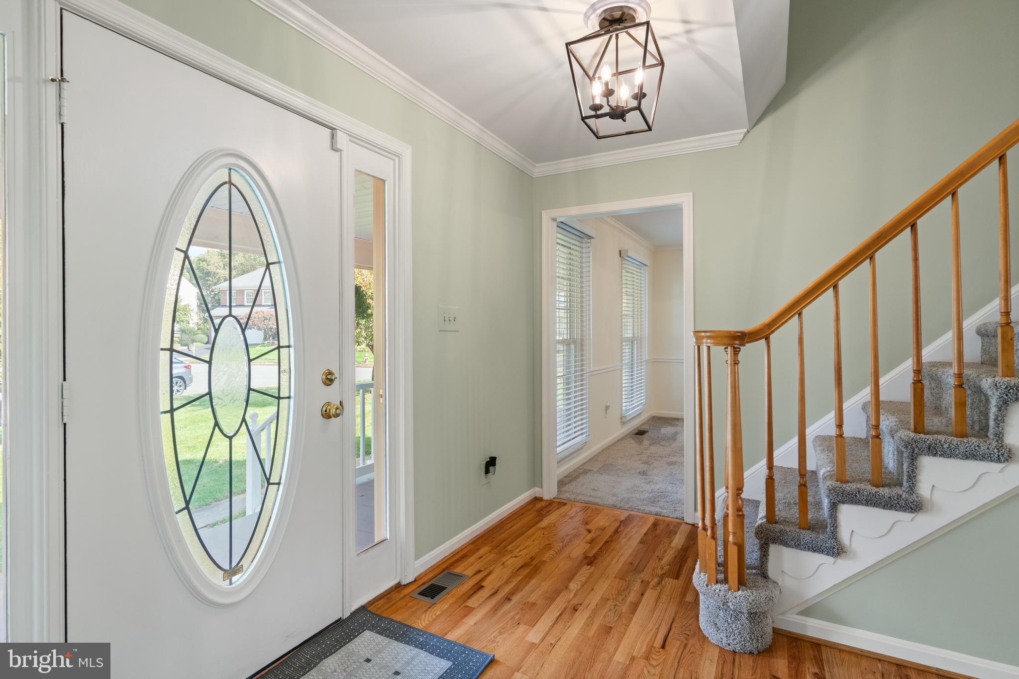 6218 Stonehunt Place Clifton, VA 20124 - Photo 6 of 37 a view of a livingroom with wooden floor and door