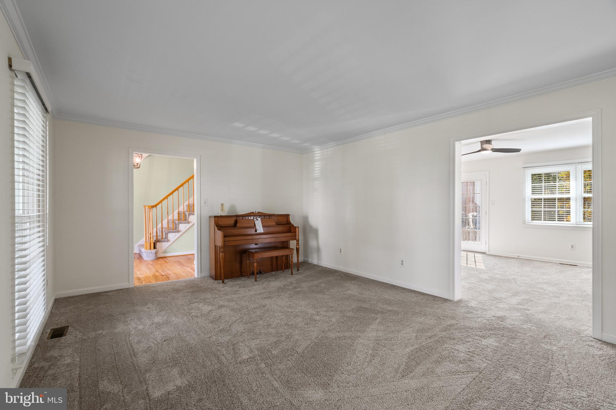 6218 Stonehunt Place Clifton, VA 20124 - Photo 9 of 37 a view of an empty room with furniture and windows