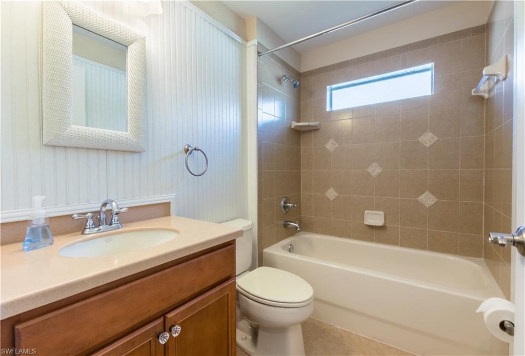 19741 Villa Rosa Loop Estero, FL 33967 - Photo 14 of 21 a bathroom with a sink a toilet and shower