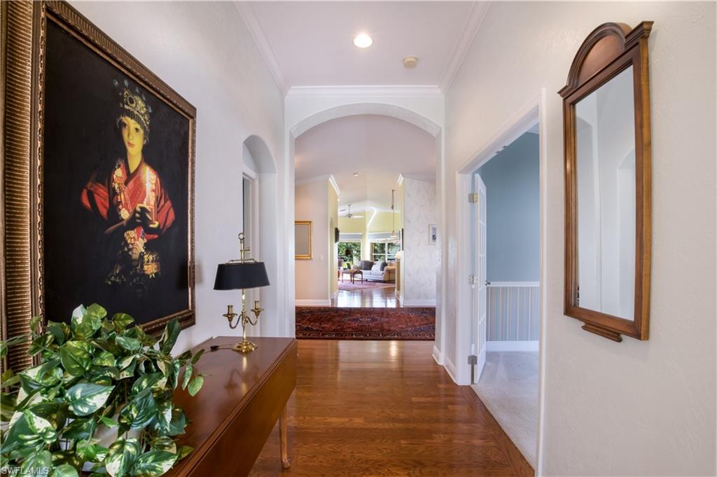 19741 Villa Rosa Loop Estero, FL 33967 - Photo 3 of 21 a view of a hallway to a livingroom with furniture