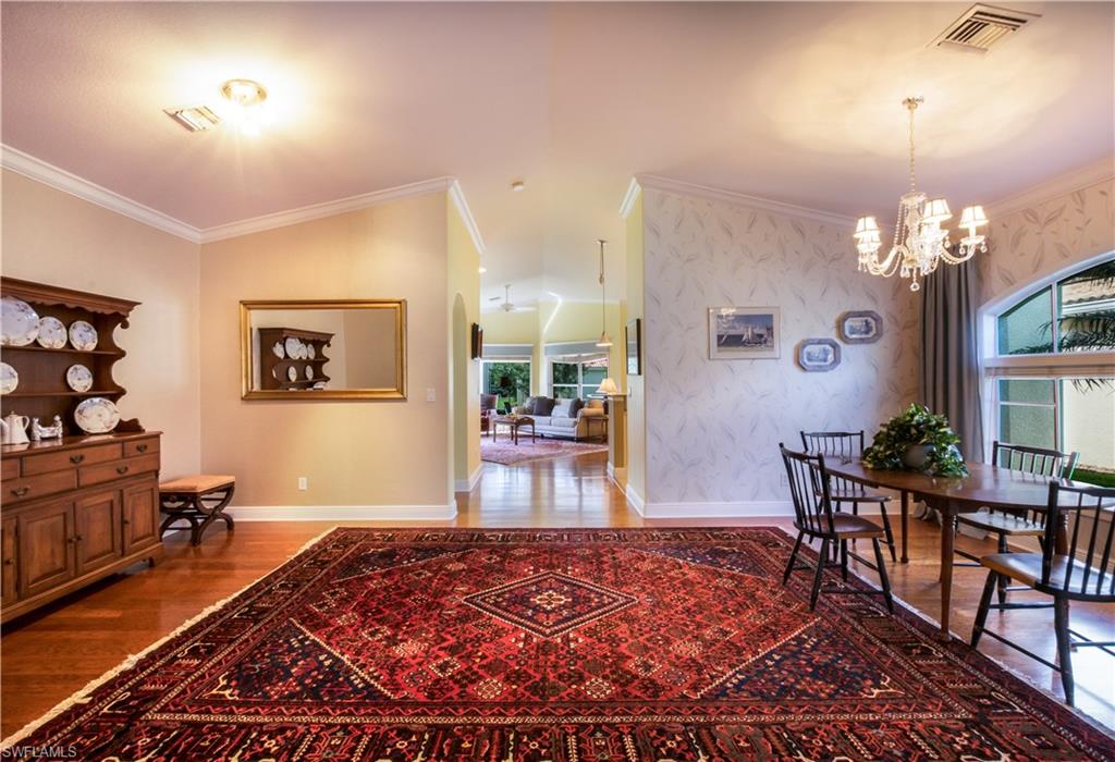 19741 Villa Rosa Loop Estero, FL 33967 - Photo 4 of 21 a living room with furniture and a chandelier
