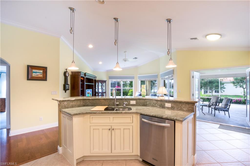 19741 Villa Rosa Loop Estero, FL 33967 - Photo 7 of 21 a kitchen with stainless steel appliances granite countertop a sink and a granite counter tops