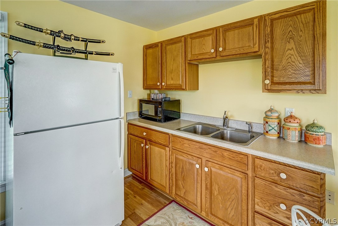 11351 Hillcrest Road Hanover, VA 23069 - Photo 34 of 48 a kitchen with refrigerator a sink and cabinets