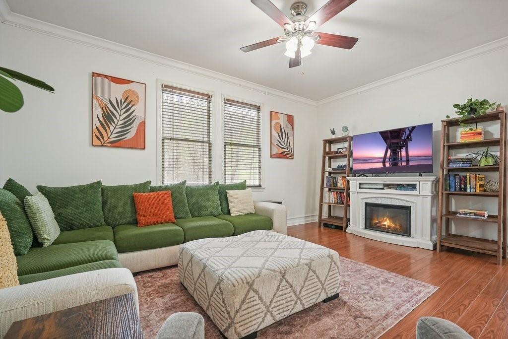 2232 Burnt Mountain Road Jasper, GA 30143 - Photo 12 of 50 a living room with furniture a flat screen tv and a fireplace