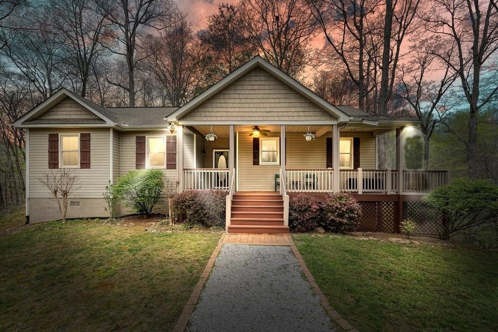 2232 Burnt Mountain Road Jasper, GA 30143 - Photo 2 of 50 a front view of a house with garden