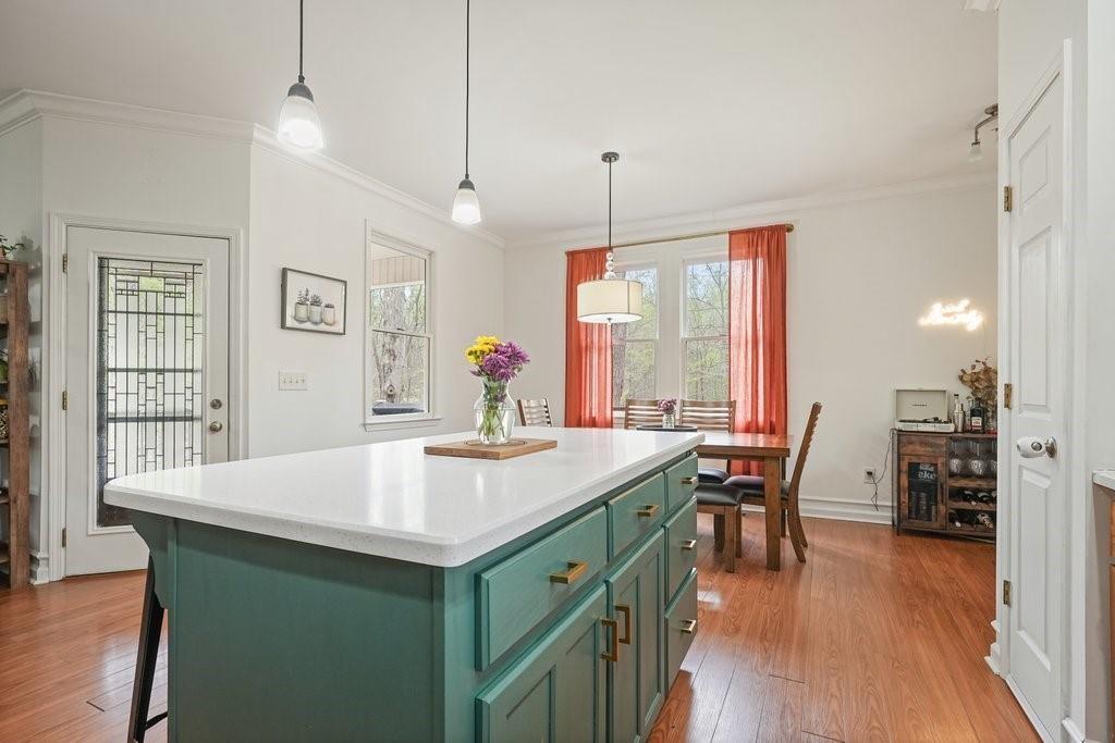 2232 Burnt Mountain Road Jasper, GA 30143 - Photo 21 of 50 a kitchen with a table chairs and wooden floor