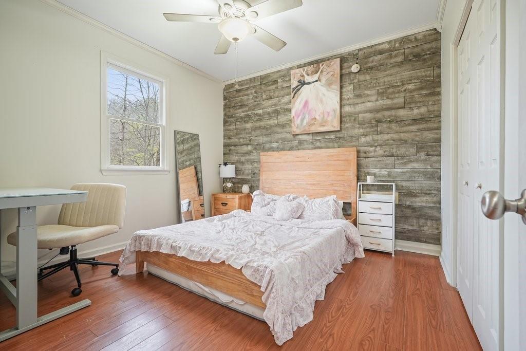 2232 Burnt Mountain Road Jasper, GA 30143 - Photo 25 of 50 a bedroom with a bed and a chair