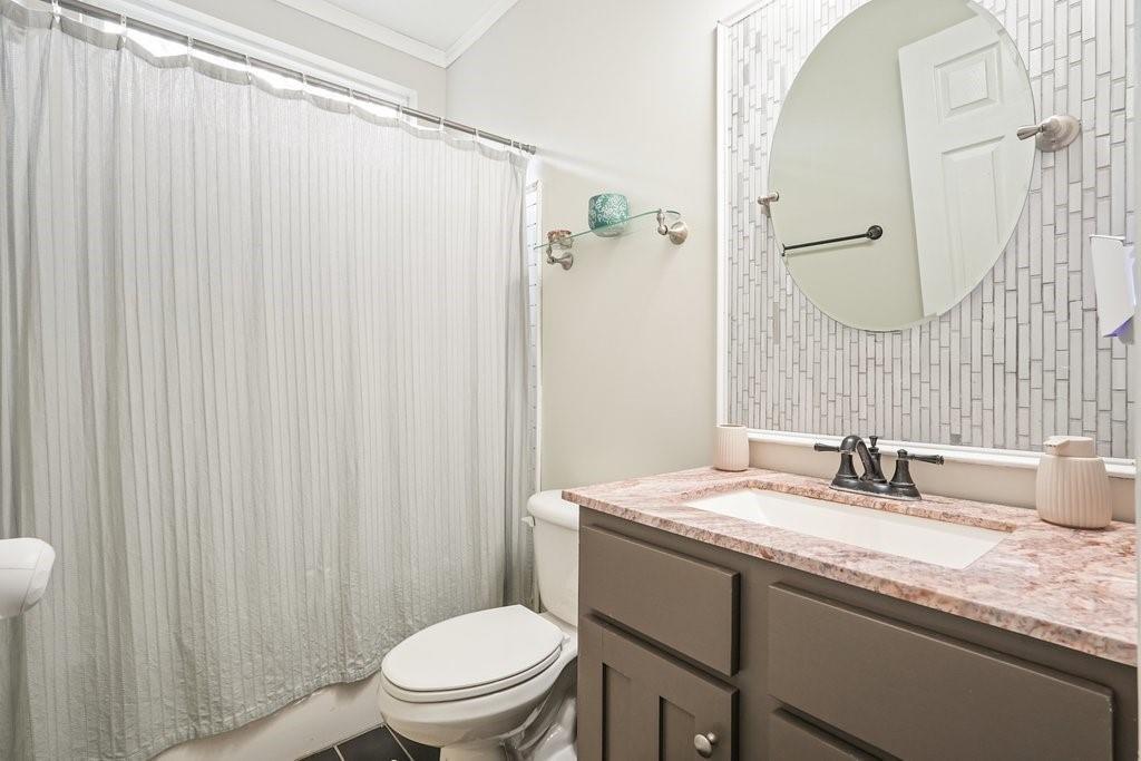 2232 Burnt Mountain Road Jasper, GA 30143 - Photo 27 of 50 a bathroom with a granite countertop sink toilet and a mirror