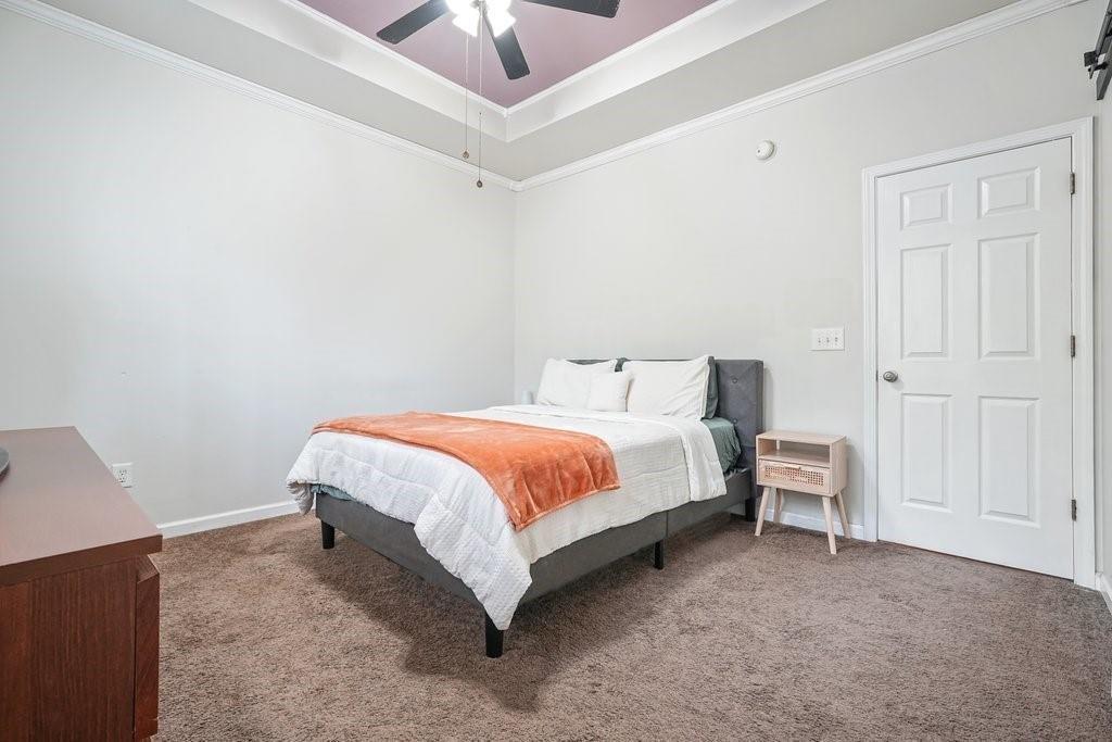 2232 Burnt Mountain Road Jasper, GA 30143 - Photo 31 of 50 a bed room with a bed and a chandelier