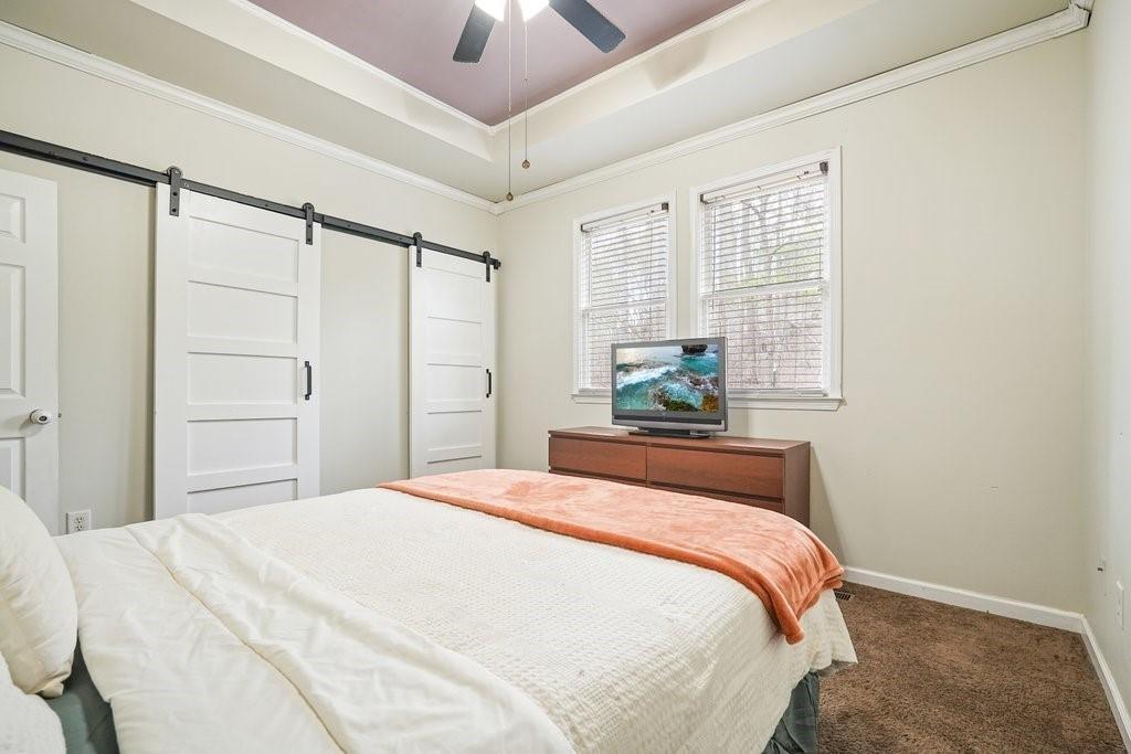 2232 Burnt Mountain Road Jasper, GA 30143 - Photo 32 of 50 a bedroom with a bed and a window