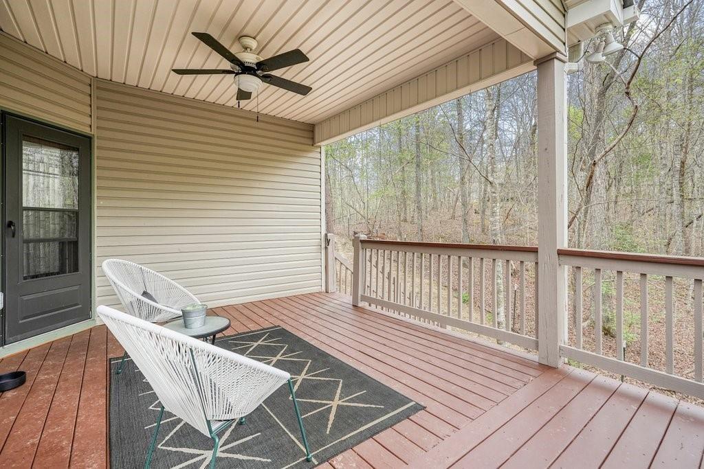 2232 Burnt Mountain Road Jasper, GA 30143 - Photo 36 of 50 a view of a chairs on the deck