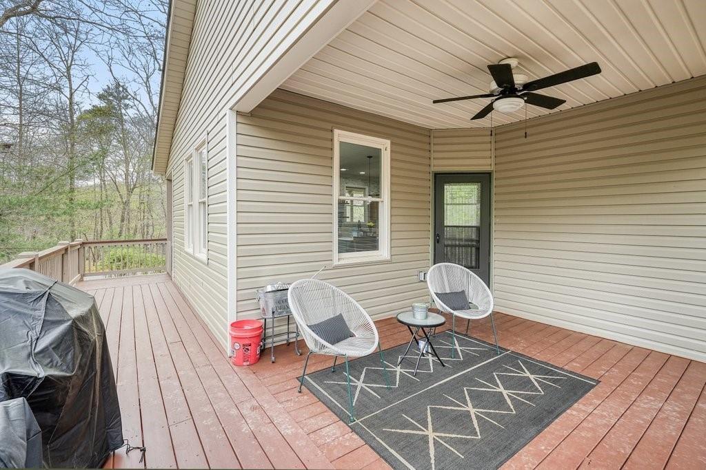 2232 Burnt Mountain Road Jasper, GA 30143 - Photo 39 of 50 a view of a chairs and table in the balcony