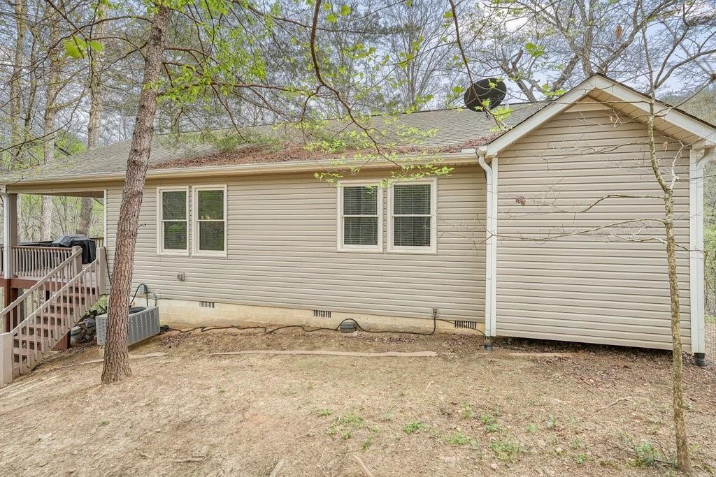 2232 Burnt Mountain Road Jasper, GA 30143 - Photo 44 of 50 a view of a house with a yard