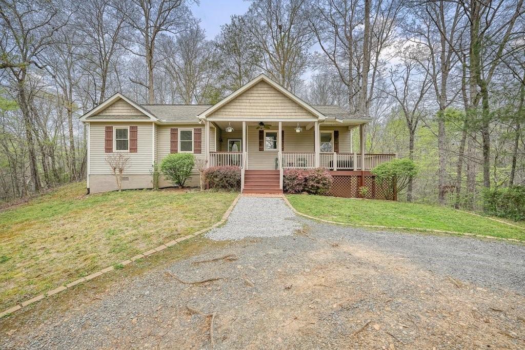 2232 Burnt Mountain Road Jasper, GA 30143 - Photo 5 of 50 a front view of house with yard and green space