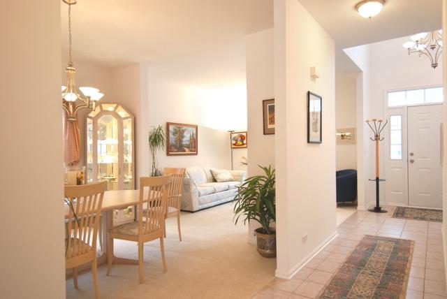 231 South Quentin Road Palatine, IL 60067 - Photo 2 of 10 a view of a livingroom with furniture and a chandelier