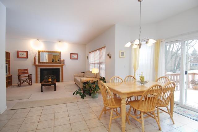 231 South Quentin Road Palatine, IL 60067 - Photo 5 of 10 a outdoor space with furniture a fireplace and a chandelier