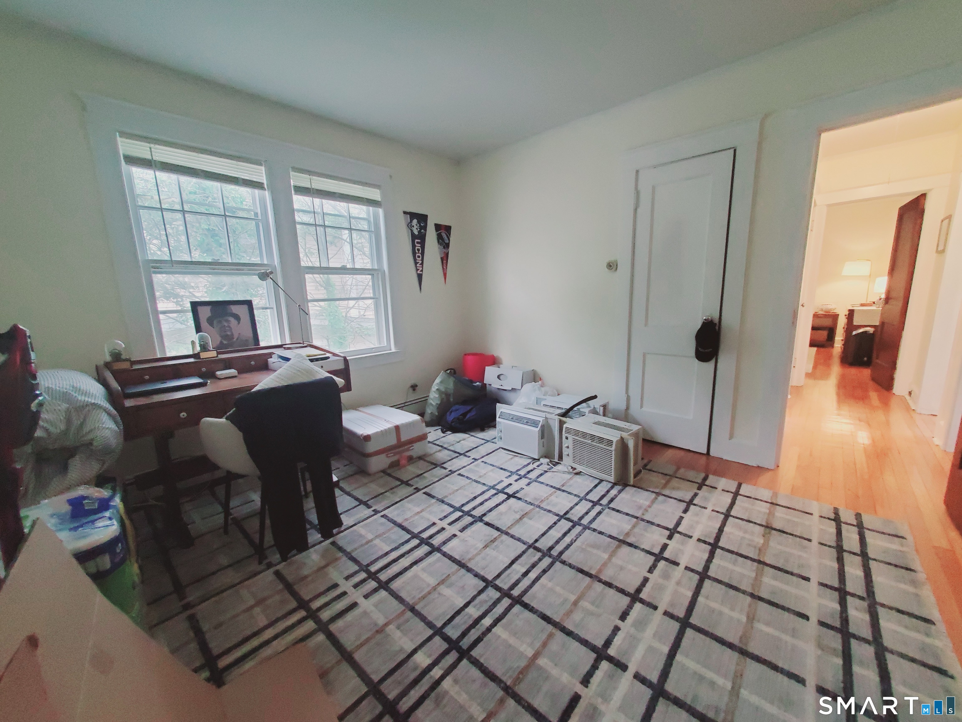 100 Colonial Road, Unit 2 Stamford, CT 06906 - Photo 7 of 8 a living room with furniture a window and wooden floor