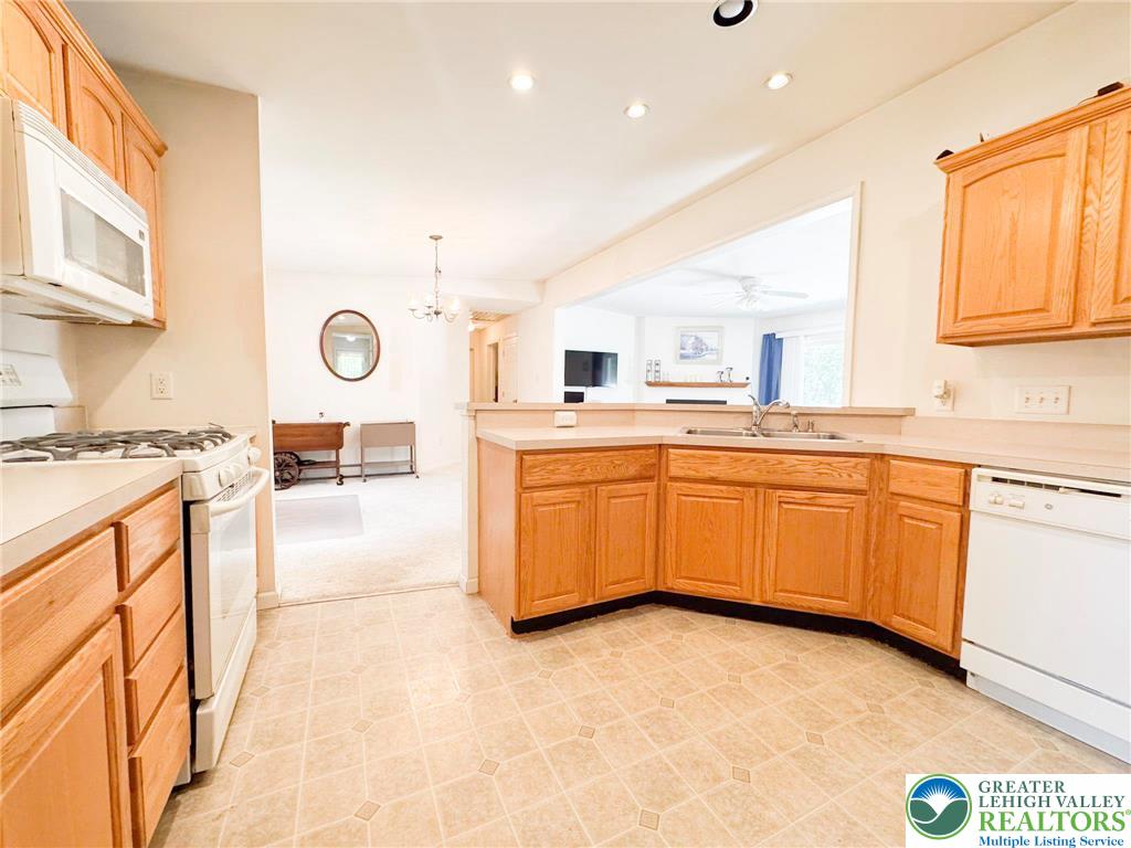 111 Turkey Ridge Kunkletown, PA 18058 - Photo 6 of 30 a kitchen with a sink a stove cabinets and a window