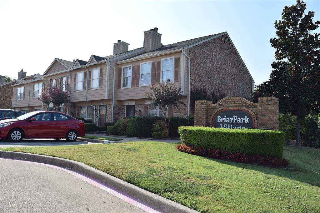 2400 Jupiter Road, Unit 2 Plano, TX 75074 - Photo 1 of 18 a front view of a house with a garden and yard