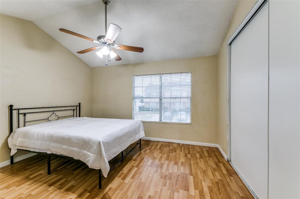 2400 Jupiter Road, Unit 2 Plano, TX 75074 - Photo 11 of 18 a bedroom with a bed and a window