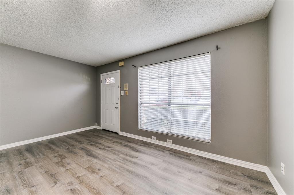 2400 Jupiter Road, Unit 2 Plano, TX 75074 - Photo 3 of 18 a view of an empty room with a window