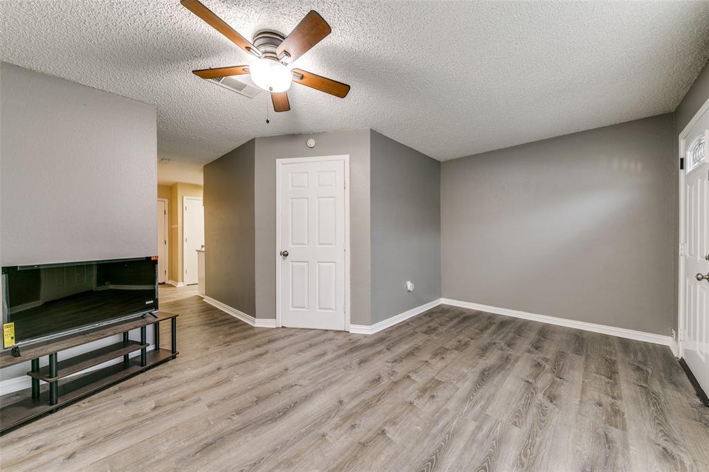 2400 Jupiter Road, Unit 2 Plano, TX 75074 - Photo 5 of 18 wooden floor in an empty room with a window