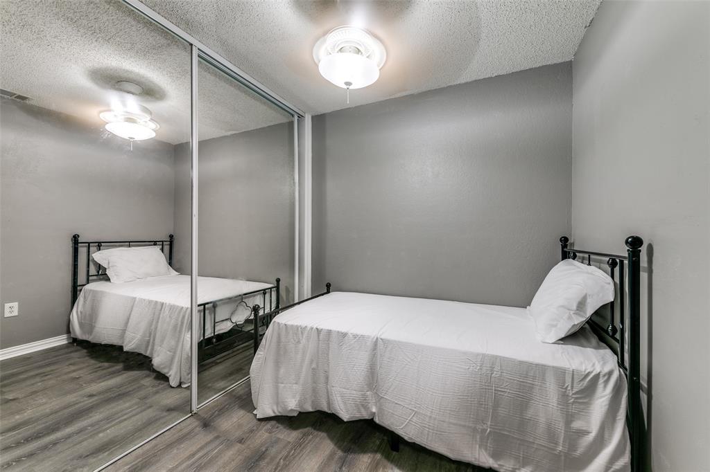 2400 Jupiter Road, Unit 2 Plano, TX 75074 - Photo 8 of 18 a bedroom with a bed and a table