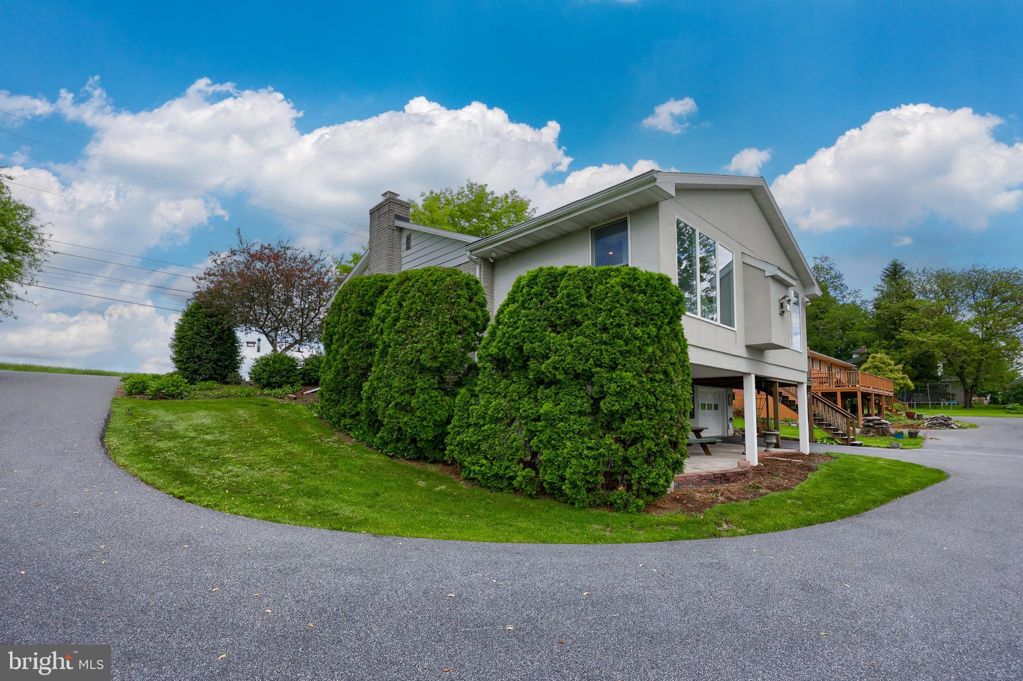 918 Lebanon Road Manheim, PA 17545 - Photo 58 of 60 a front view of a house with a garden