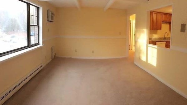 23 Spencer Road, Unit 22F Boxborough, MA 01719 - Photo 4 of 10 an empty room with windows