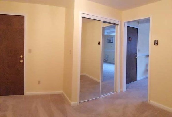 23 Spencer Road, Unit 22F Boxborough, MA 01719 - Photo 6 of 10 an empty room with wooden door