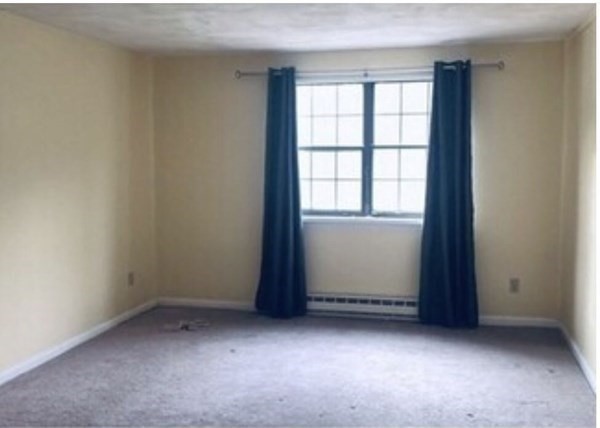23 Spencer Road, Unit 22F Boxborough, MA 01719 - Photo 7 of 10 an empty room with windows