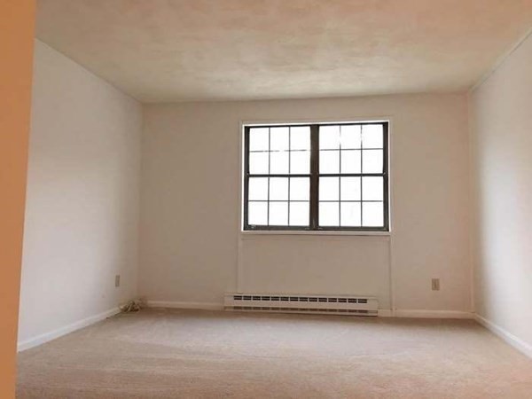 23 Spencer Road, Unit 22F Boxborough, MA 01719 - Photo 8 of 10 an empty room with a window