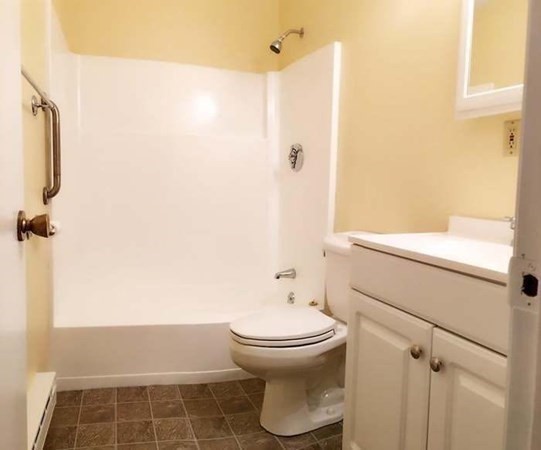 23 Spencer Road, Unit 22F Boxborough, MA 01719 - Photo 9 of 10 a bathroom with a toilet and a shower