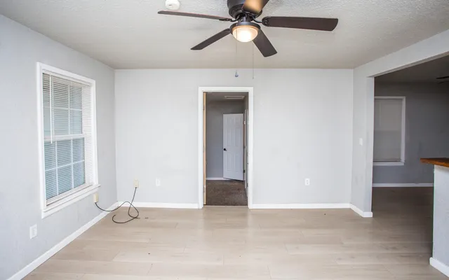 a view of an empty room with a window