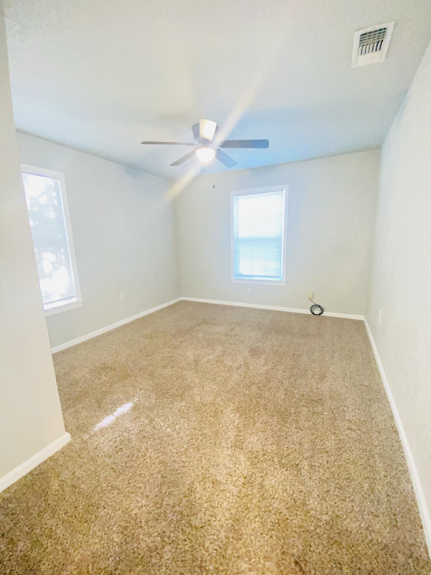 1518 40th Street Lubbock, TX 79412 - Photo 10 of 13 a view of an empty room with a window
