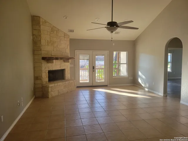 a view of an empty room with a window