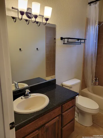 a view of a bathroom from a hallway