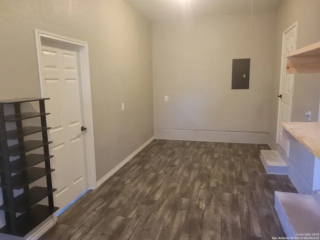 a view of walk in closet with empty racks