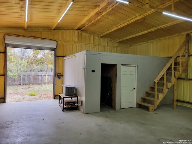 a backyard of a house with outdoor seating