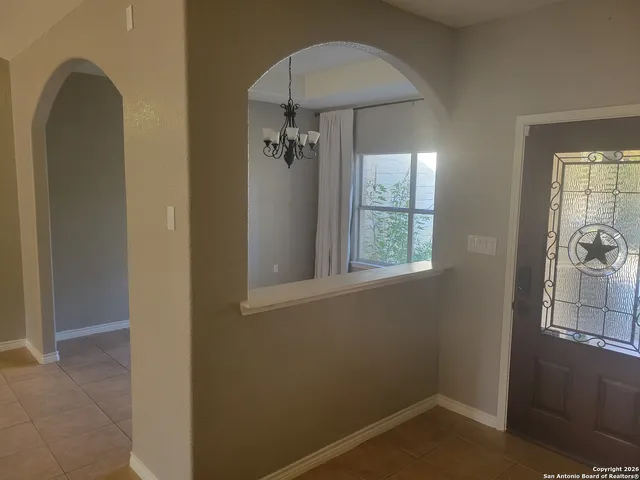 a view of a room that has a window in it