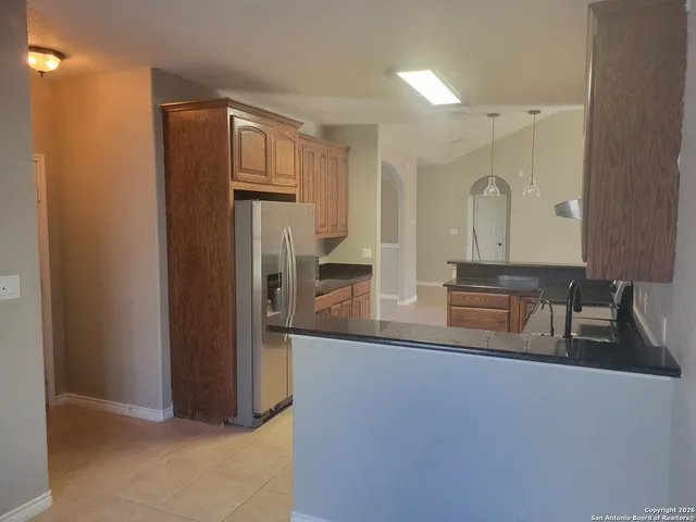 a view of a kitchen from the hallway