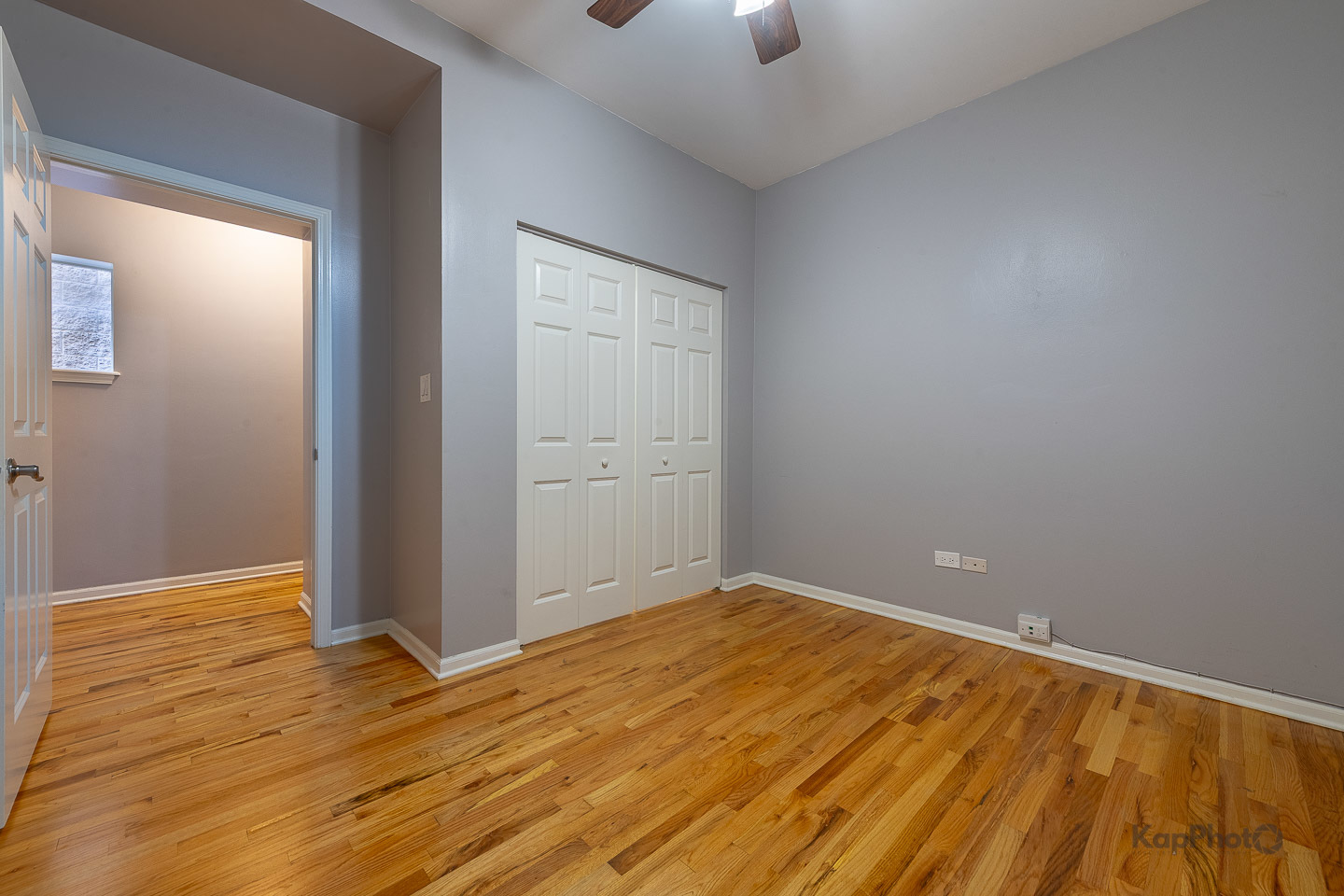 2142 West Madison Street, Unit 1 Chicago, IL 60612 - Photo 16 of 27 wooden floor in an empty room