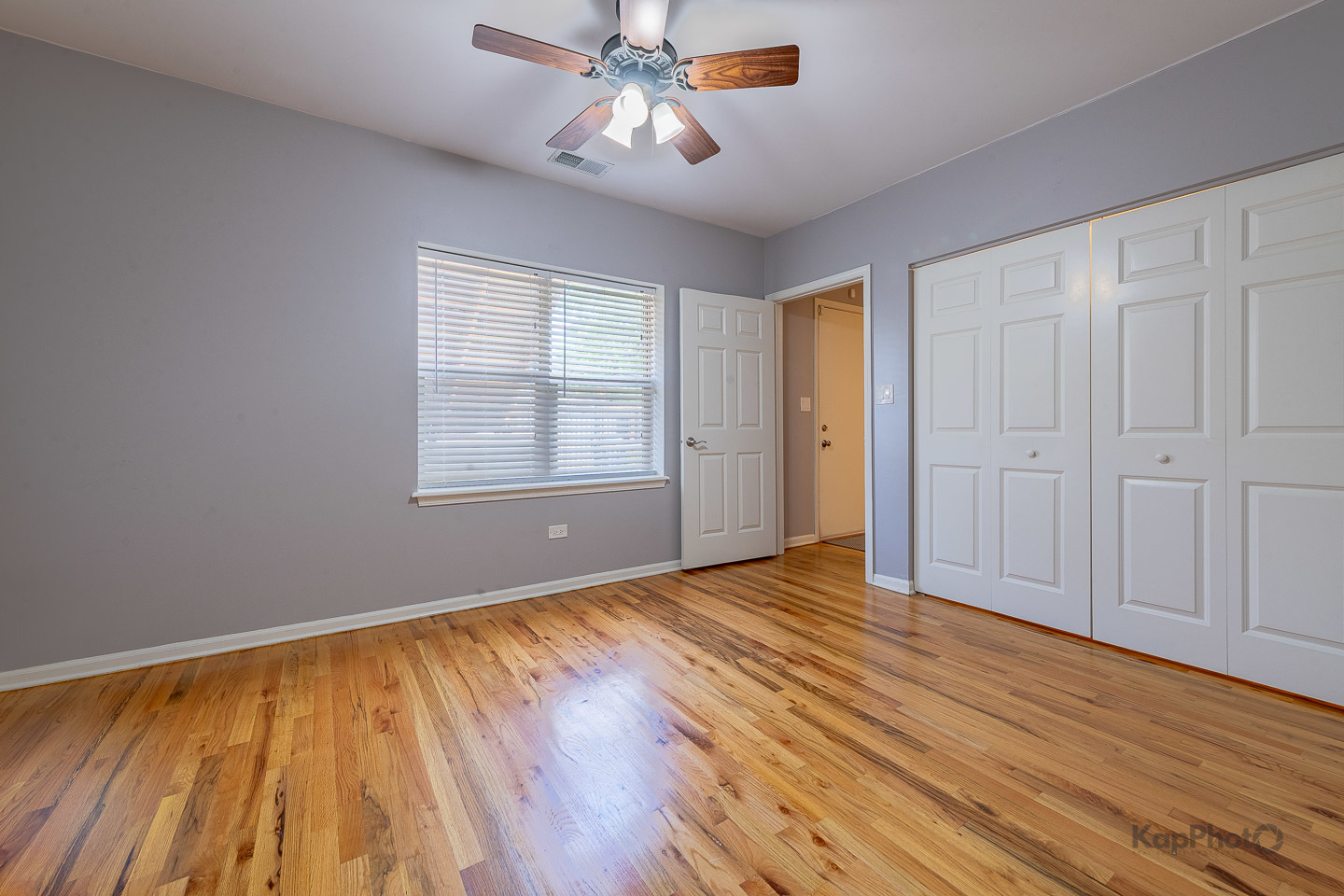 2142 West Madison Street, Unit 1 Chicago, IL 60612 - Photo 19 of 27 a view of empty room with wooden floor and fan